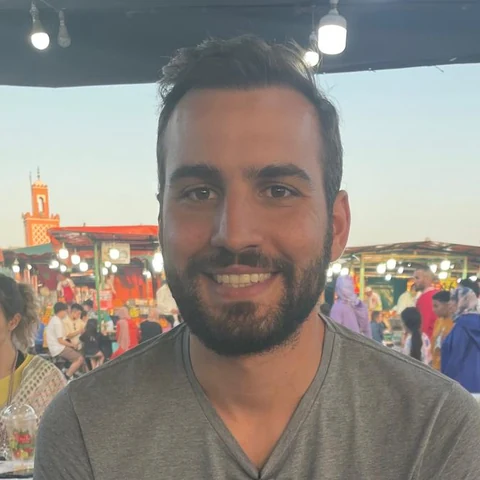 Andreas, at a busy food stall in a Marrakech square.